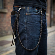 Close-up of a man wearing a thick 65cm wallet chain with 1.5cm links in an urban style setting