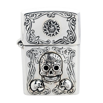 A front view of the handmade sterling silver Mexican sugar skull Zippo case.