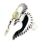 A Native American style eagle ring in sterling silver, with artistically outstretched wings and a golden sun symbol.