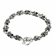 The ornate twisted link sterling silver bracelet with a toggle clasp, shown on a white background.
