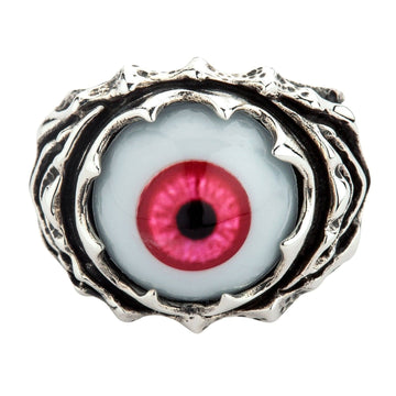 Top view of a sterling silver ring featuring a large polymer eyeball with a deep crimson iris held in a jagged claw setting.