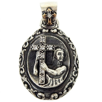 Front view of the Saint & Cross Medallion Pendant featuring a figure holding a CZ-lined cross against oxidized sterling silver