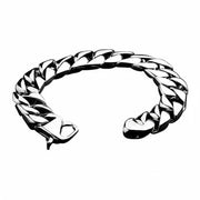 A close-up of the secure lobster claw clasp on the heavy sterling silver Cuban link bracelet.