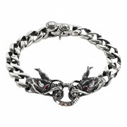 A men's solid sterling silver dragon bracelet with a 12mm Cuban link chain and a double dragon head clasp.