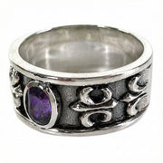 Side angle of the ring showing the intricate Fleur De Lis Gothic carving and oxidized finish