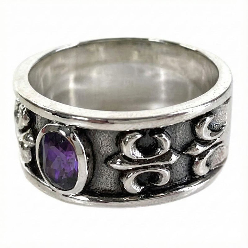 Side angle of the ring showing the intricate Fleur De Lis Gothic carving and oxidized finish
