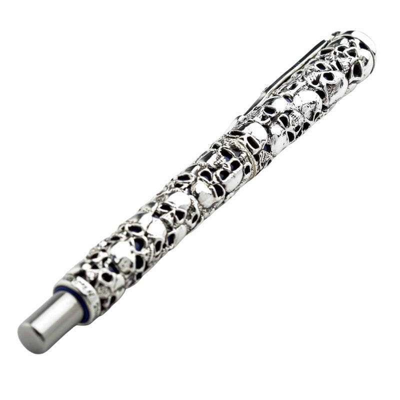 Skull carved sterling silver pen with intricate gothic skull design on white background