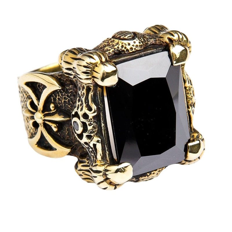 Un anillo de garra de dragón de estilo gótico en latón sólido, con una banda áspera y escamosa y un enorme ónix negro de 35 quilates.