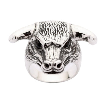 A solid sterling silver bull head ring with genuine black onyx eyes and detailed, ruggedly textured fur.