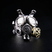 A handcrafted sterling silver gas mask ring with industrial steampunk details and a brass filter.
