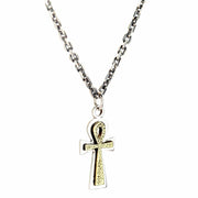 The sterling silver and brass Ankh pendant hanging from a silver chain.