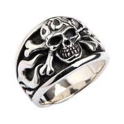 An angled view of the sterling silver biker skull ring, highlighting the flame engravings on the band.