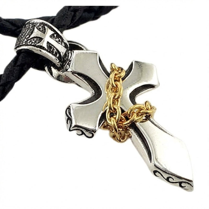 Close-up detail of 925 sterling silver cross with 14k gold plated chain wrap accent