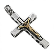 Sterling silver crucifix pendant with gold-plated Jesus corpus and Iron Cross side accents, angled view showing detail
