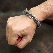Sterling silver dragon biker bracelet worn on man's wrist showing detailed scale design