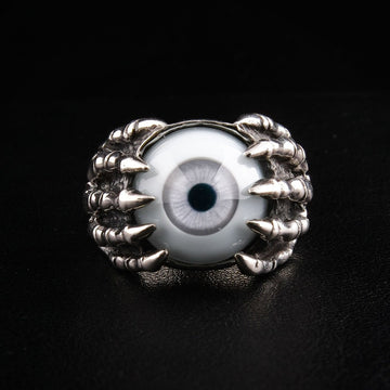 Sterling silver eyeball ring with skeleton claw design front view showing gray acrylic eye gripped by detailed bone fingers