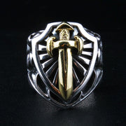 Front view of the sterling silver knight shield ring, featuring a gold-plated sword and radiating background.