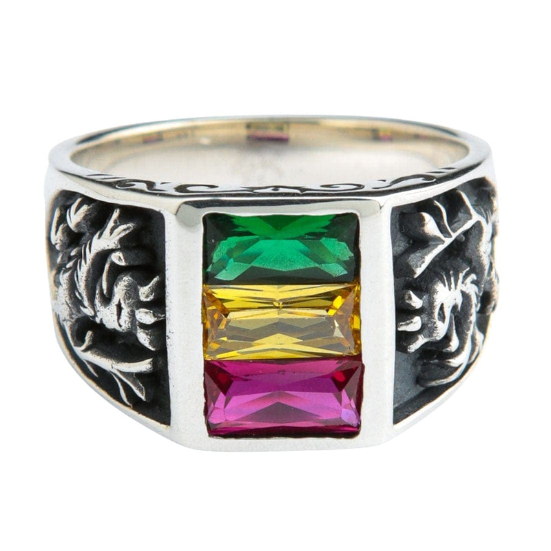 A sterling silver Lion of Judah ring with green, yellow, and red Rasta colored gemstones on a white background.