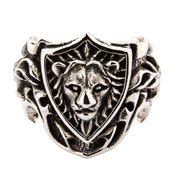 Front view of sterling silver ring featuring a lion head inside a knight's shield.