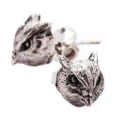 A pair of handcrafted sterling silver owl stud earrings with detailed feathers, isolated on a white background.