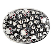 A front view of the men's sterling silver skull pile belt buckle, showing a cluster of polished skulls with red CZ eyes and an oxidized background.