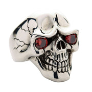 Sterling silver skull ring with red garnet CZ eyes front view showing detailed teeth and cracked skull design