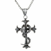 A handcrafted sterling silver necklace pendant showing a snake wrapped around a textured gothic cross.