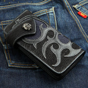 A custom biker wallet made from black shark skin with a stunning navy blue stingray flame inlay and a solid silver skull snap.