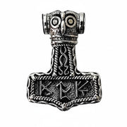 A front view of the Thor's hammer pendant, featuring an owl face and Elder Futhark style runes.