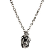 A complete sterling silver tiger skull necklace shown on a heavy silver rolo chain against a white background.