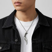 Man wearing Sterling Silver Knife Pendant with denim jacket