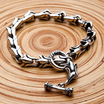 Tribal floral sterling silver chain bracelet 925 handcrafted with toggle clasp on wooden surface