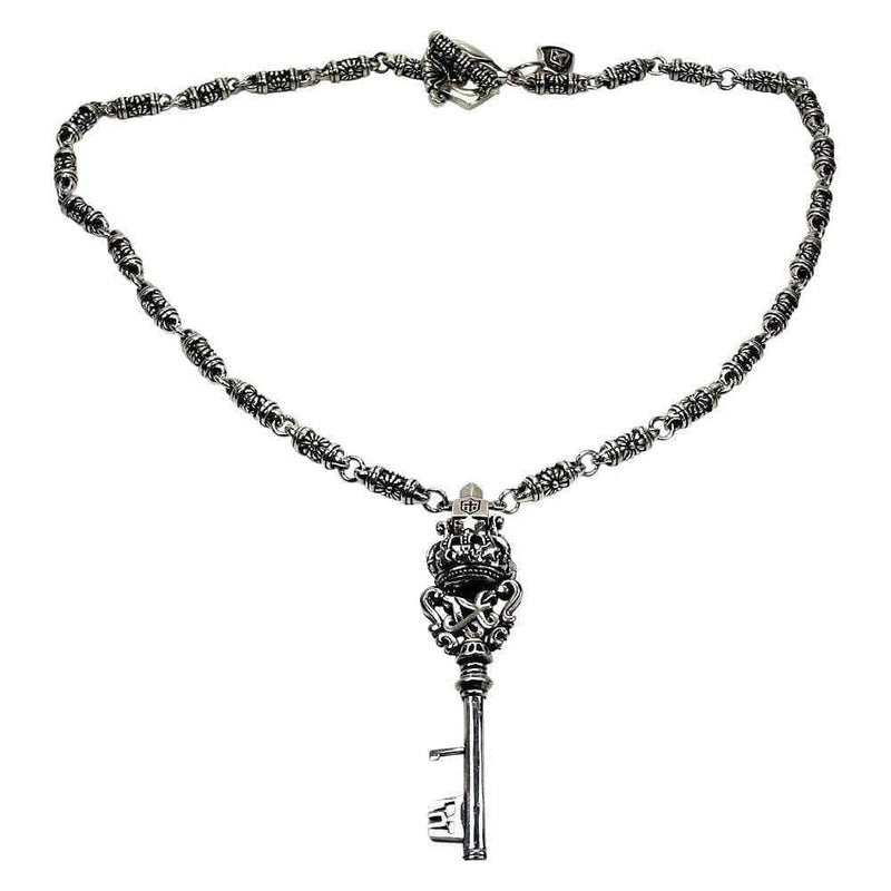Tribal rocker crown key sterling silver men's necklace with ornate tribal chain displayed on white background