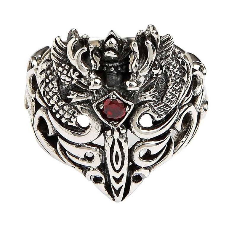 Vue de dessus de l'anneau gardien des jumeaux avec une pierre de grenat rouge sang et un design de dragon symétrique.
