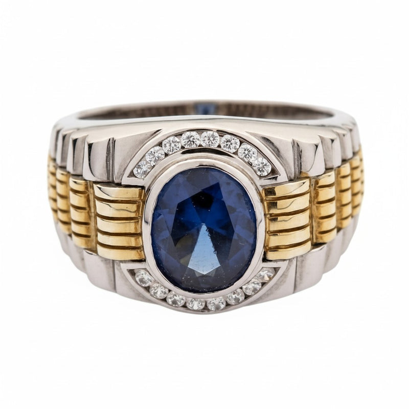A front view of the men's two-tone Rolex-inspired ring with a blue sapphire stone.