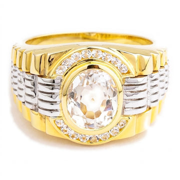 Front view of a men's white topaz ring with a clear oval stone, CZ halo, and two-tone gold watch-band design