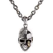 Front view of the complete worm skull necklace, showing the two-tone silver and brass pendant on a sturdy sterling silver chain.