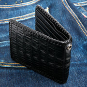 A genuine black crocodile leather biker wallet with beautiful, hand-braided edges and a silver grommet for a chain.