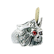 A solid sterling silver and gold-plated feathered pirate skull ring with fiery, ruby-red CZ eyes and a detailed tricorn hat.