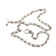 A full layout of the heavy 7mm sterling silver curb chain necklace with its unique skull and bone toggle clasp.