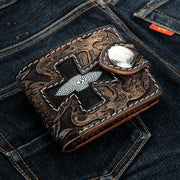 A hand-tooled leather biker wallet with a unique black stingray leather Iron Cross and surrounding skull motifs.