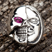 A men's Memento Mori two face ring in sterling silver, showing the half skull, half human face design.