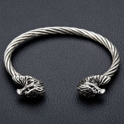 A front view of the men's cuff bracelet, showing the two sterling silver eagle heads and the twisted steel band.