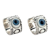Angled view of 925 sterling silver evil eye earrings showing realistic design