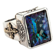 An angled view of the men's mystic quartz medieval gothic ring, showing the color-shifting stone.