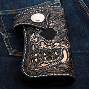 A premium, hand-tooled leather devil skull wallet with genuine, exotic snakeskin and stingray skin inlays.