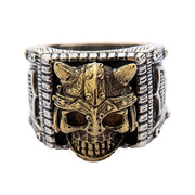 Studio shot of the two-tone Viking warrior ring highlighting the gold helmet accents against the silver skull.