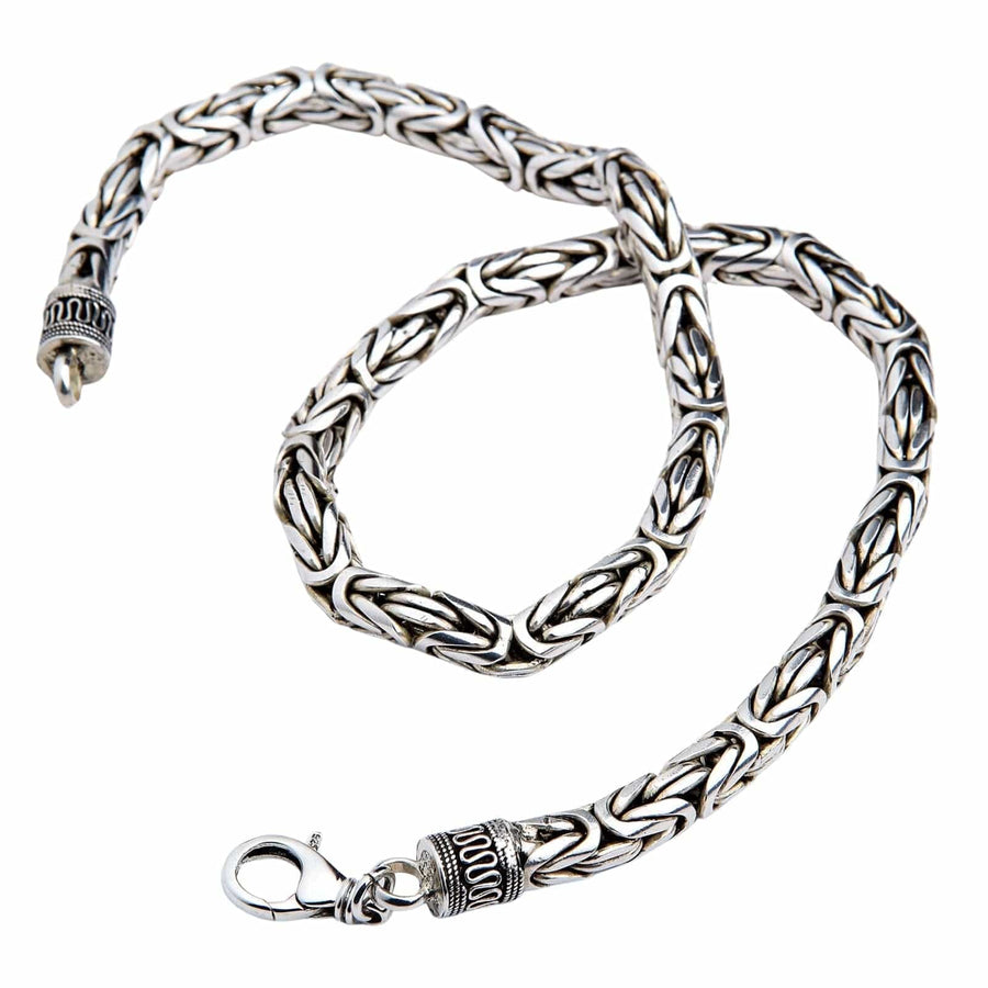 A heavy 8mm sterling silver Byzantine necklace with ornate end caps and a lobster clasp.