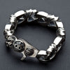 Handcrafted 925 sterling silver curb chain bracelet with tribal patterns displayed coiled