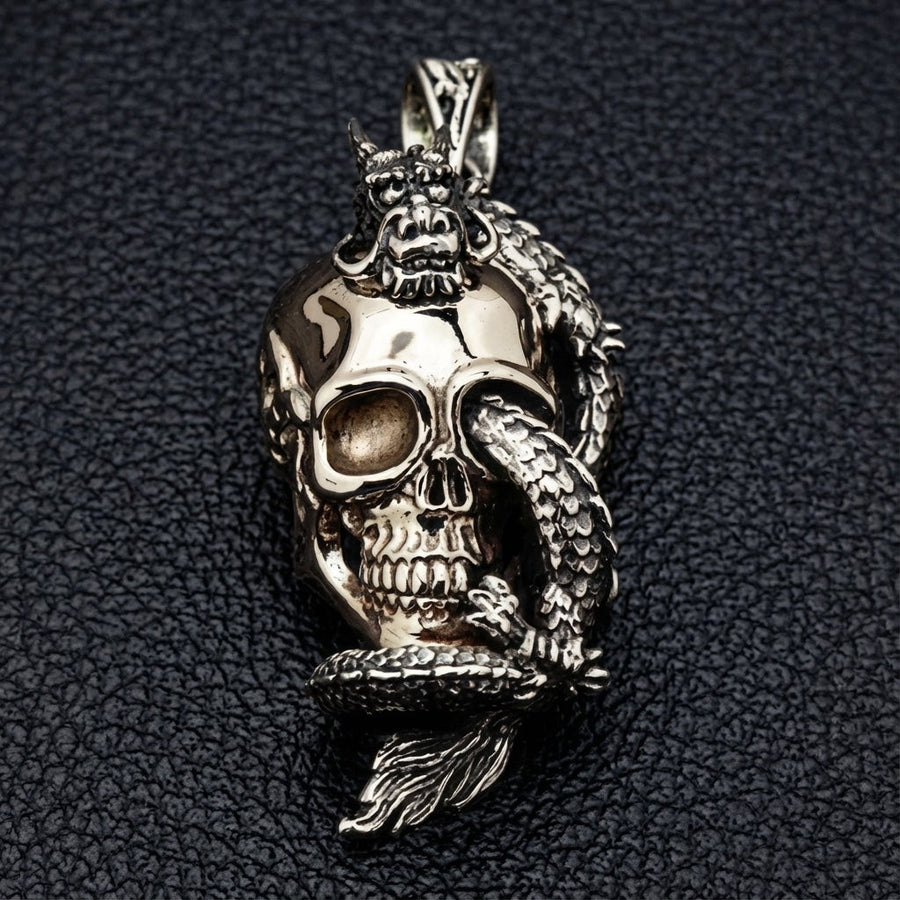 Front view of 925 sterling silver dragon wrapping a brass skull pendant
